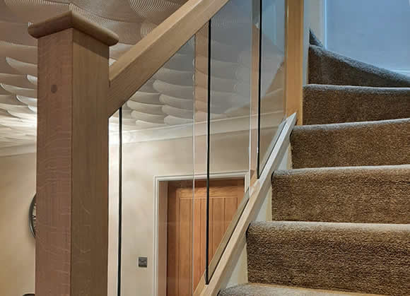 example of an oak and glass staircase makeover in Astley